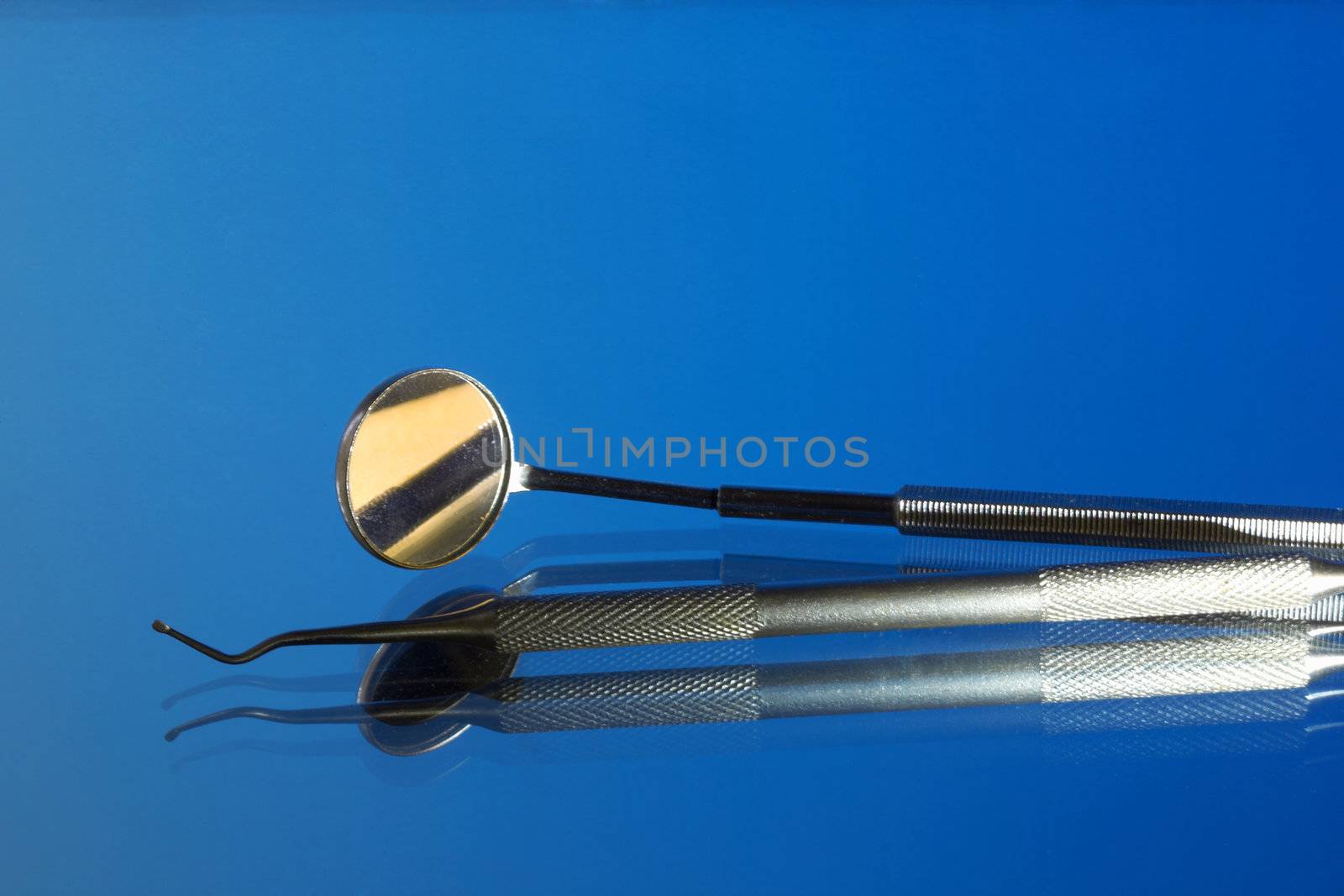 Set of dental tools on a blue background