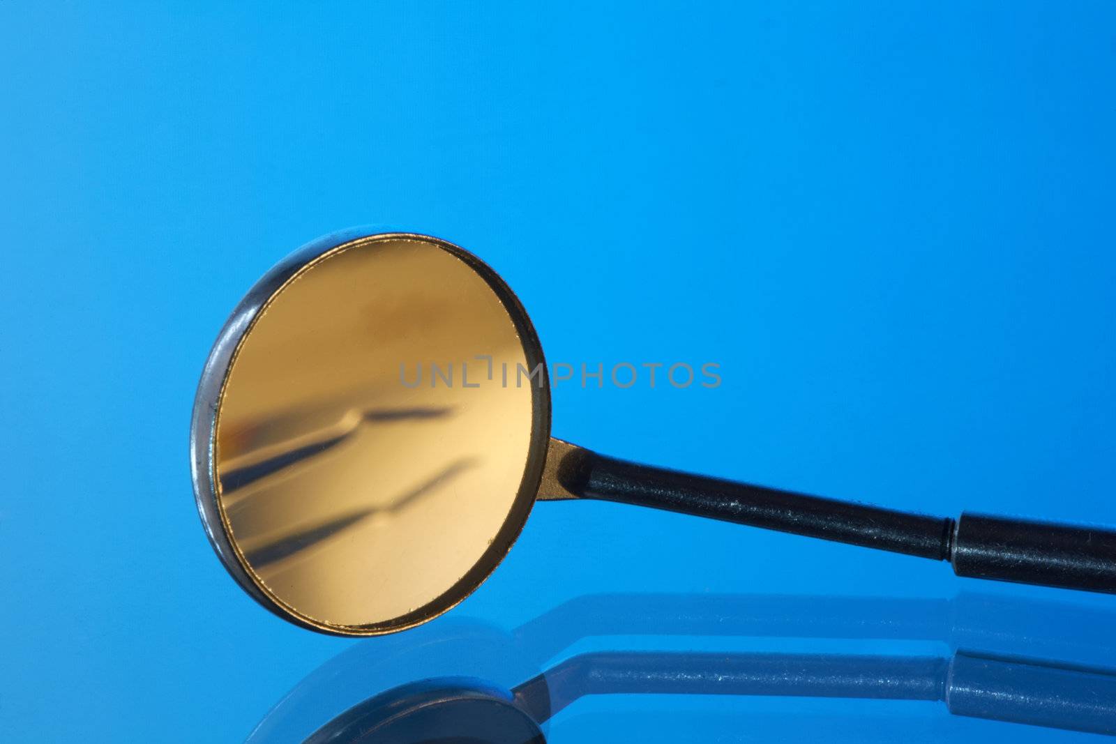 Set of dental tools on a blue background