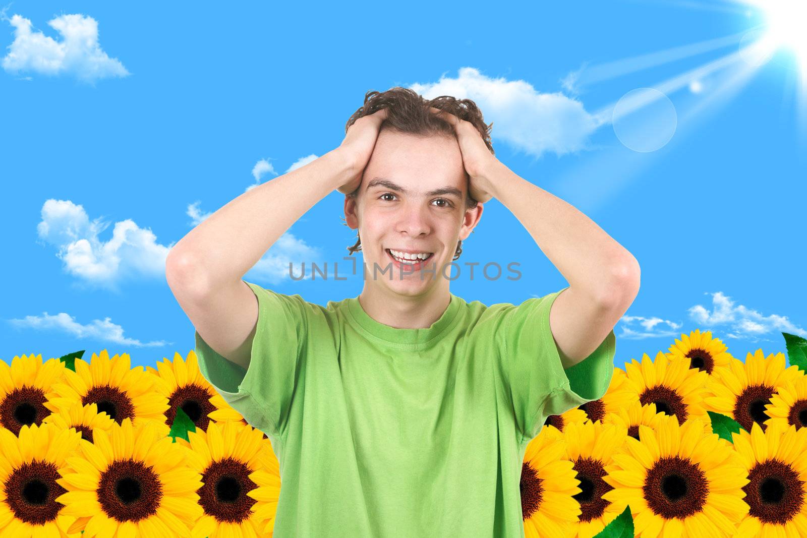 Portrait the white man in a garden. Sunflower