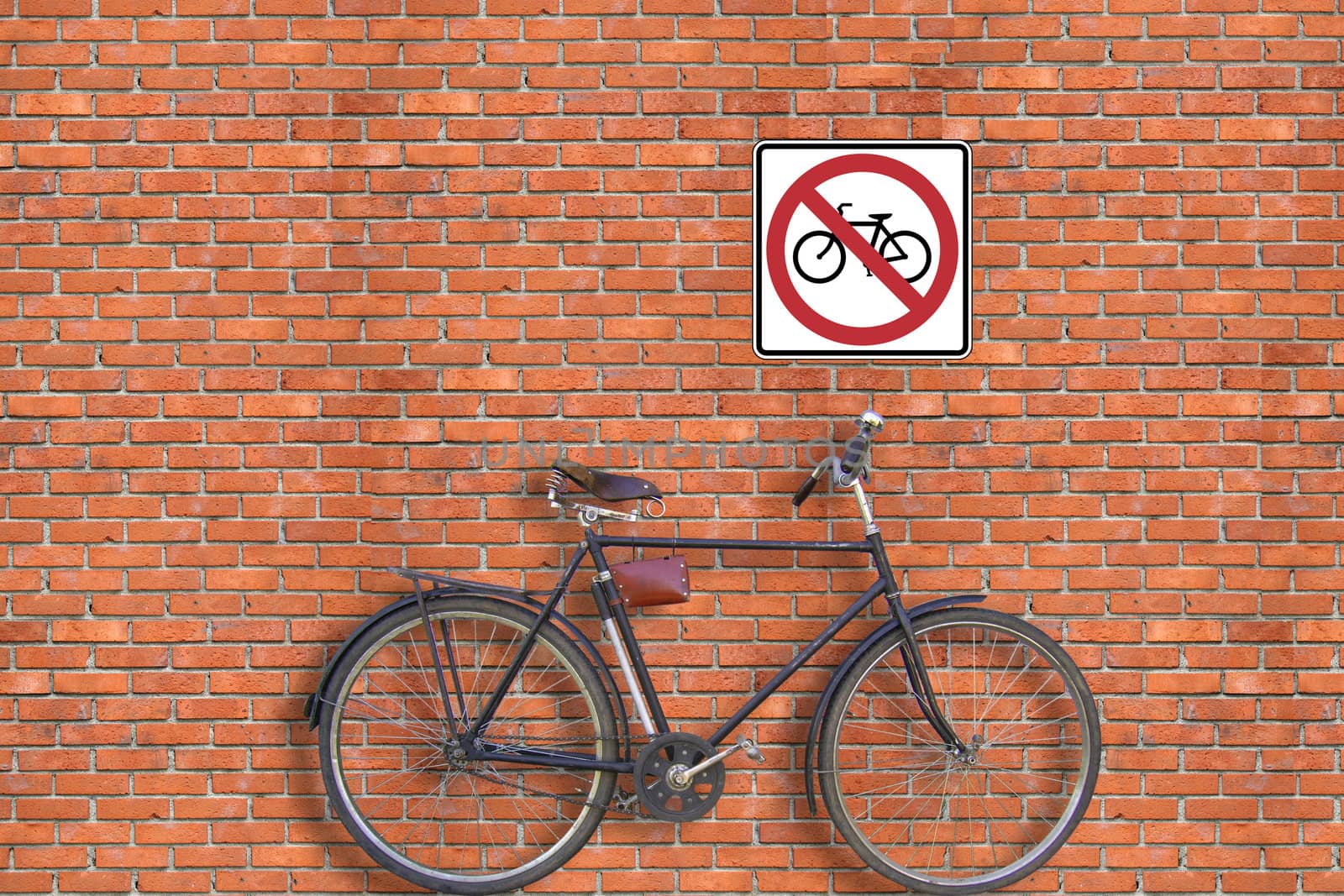Sign. Brick wall and bicycle by petrkurgan