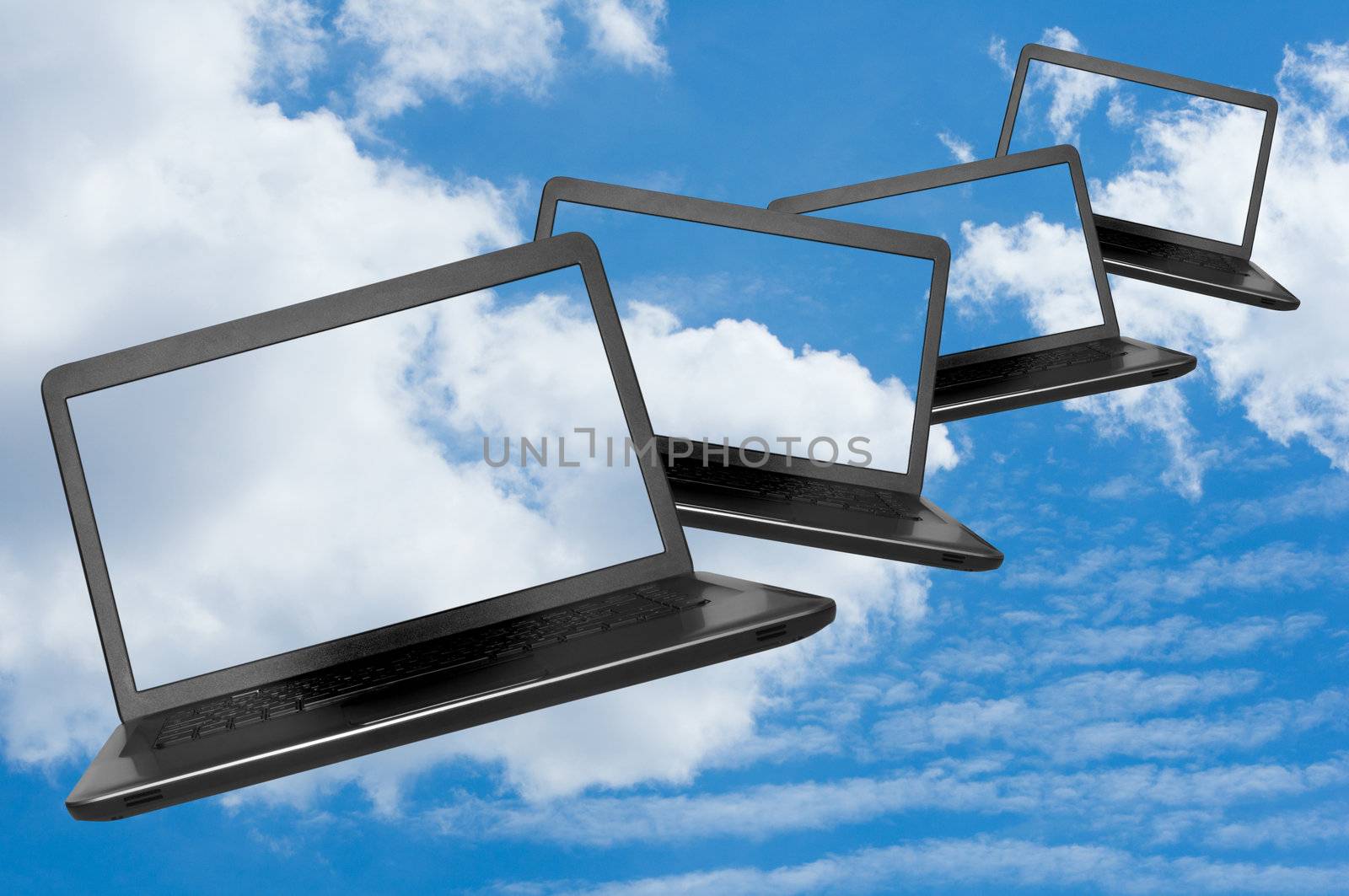 Cloud Computing - Flying Notebooks on Summer blue sky with clouds