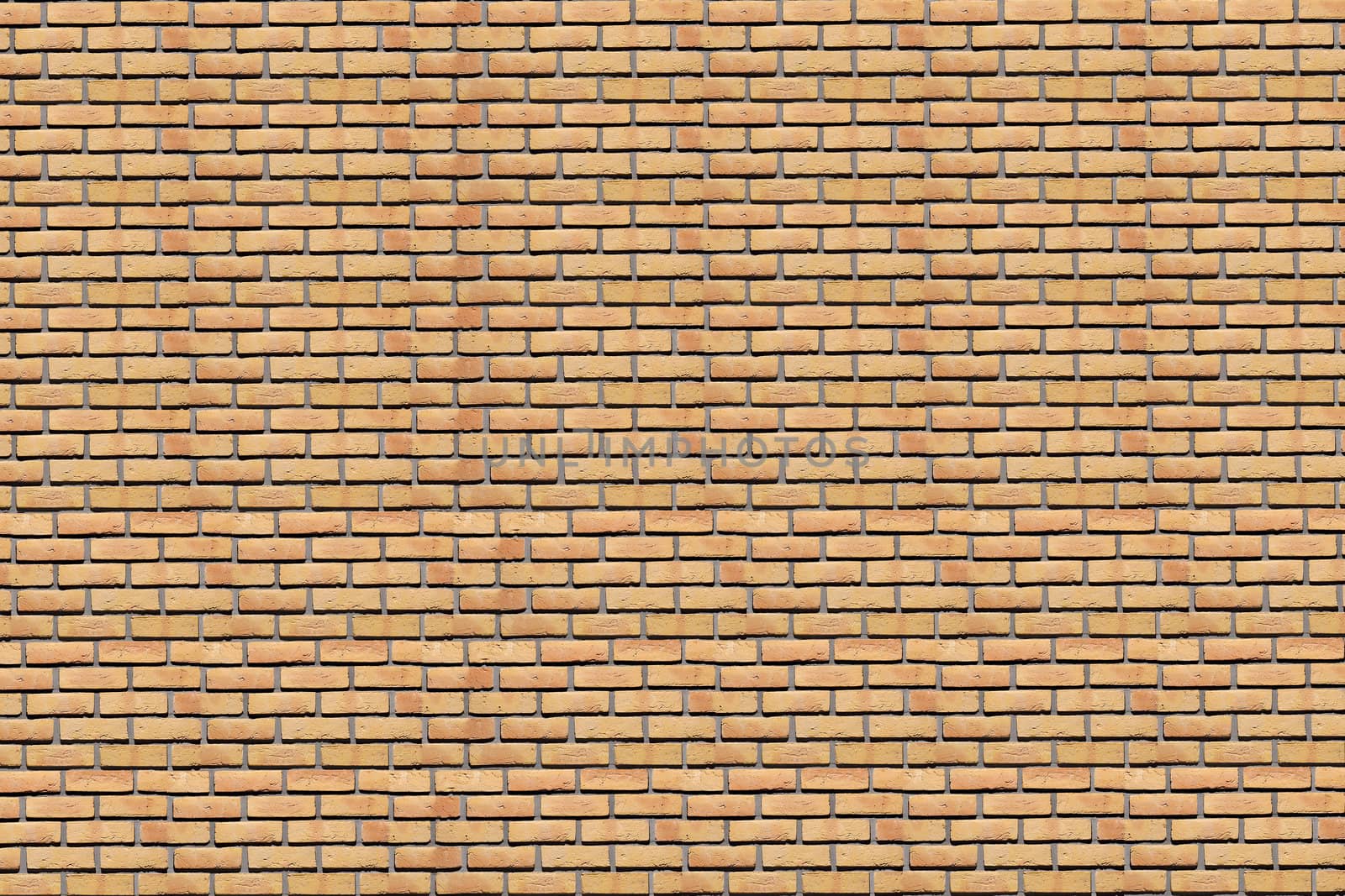 A background. Wall of a house from a yellow brick