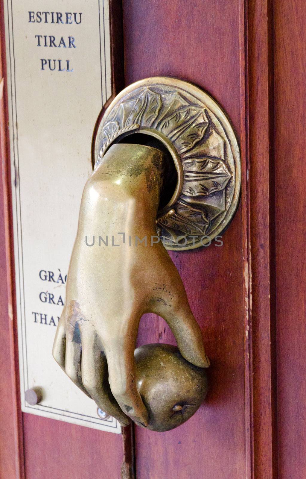 Antique bell pull on a door in Barcelona Spain