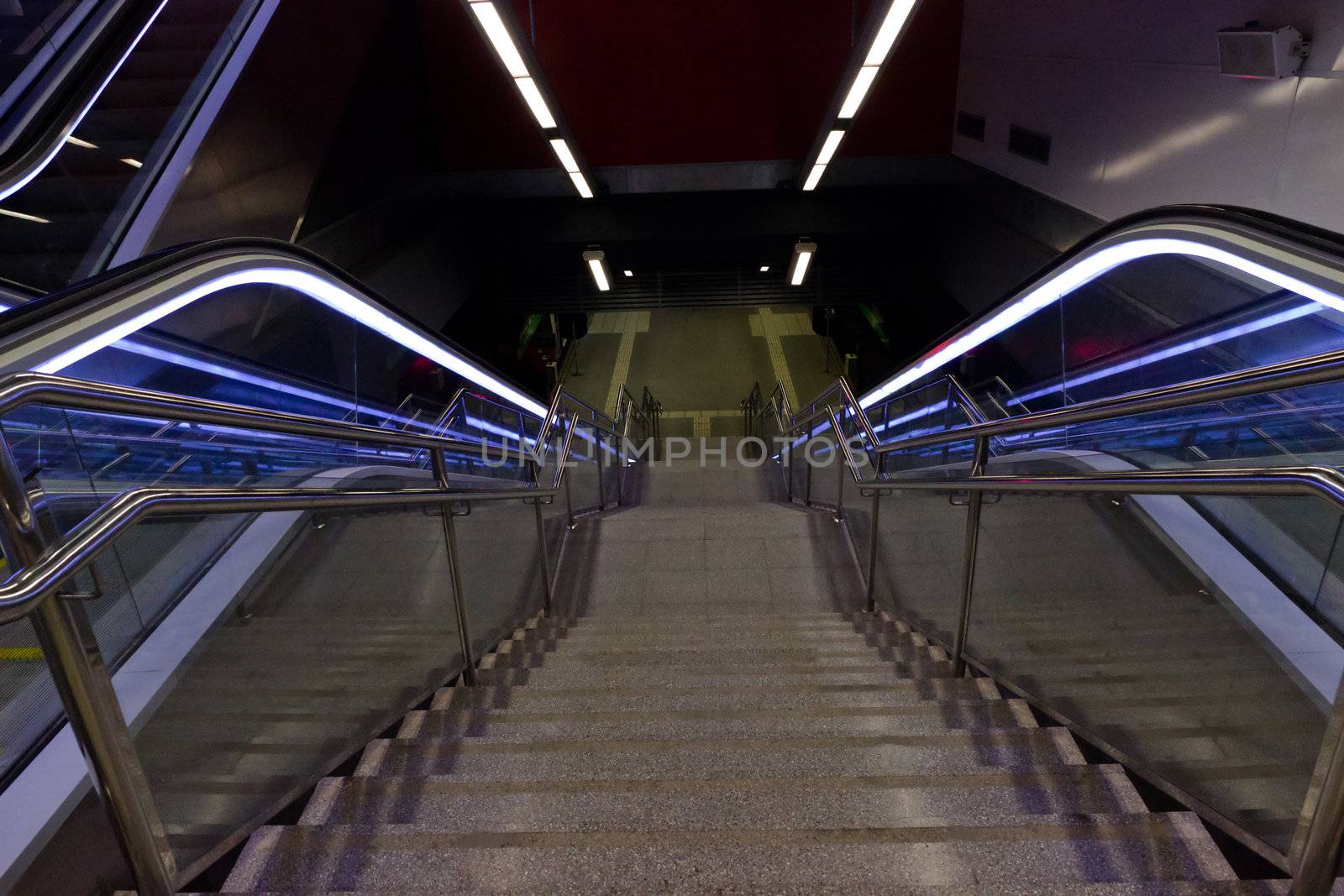 Stairway and eksalator blue light, stairway - Metro a station Barcelona