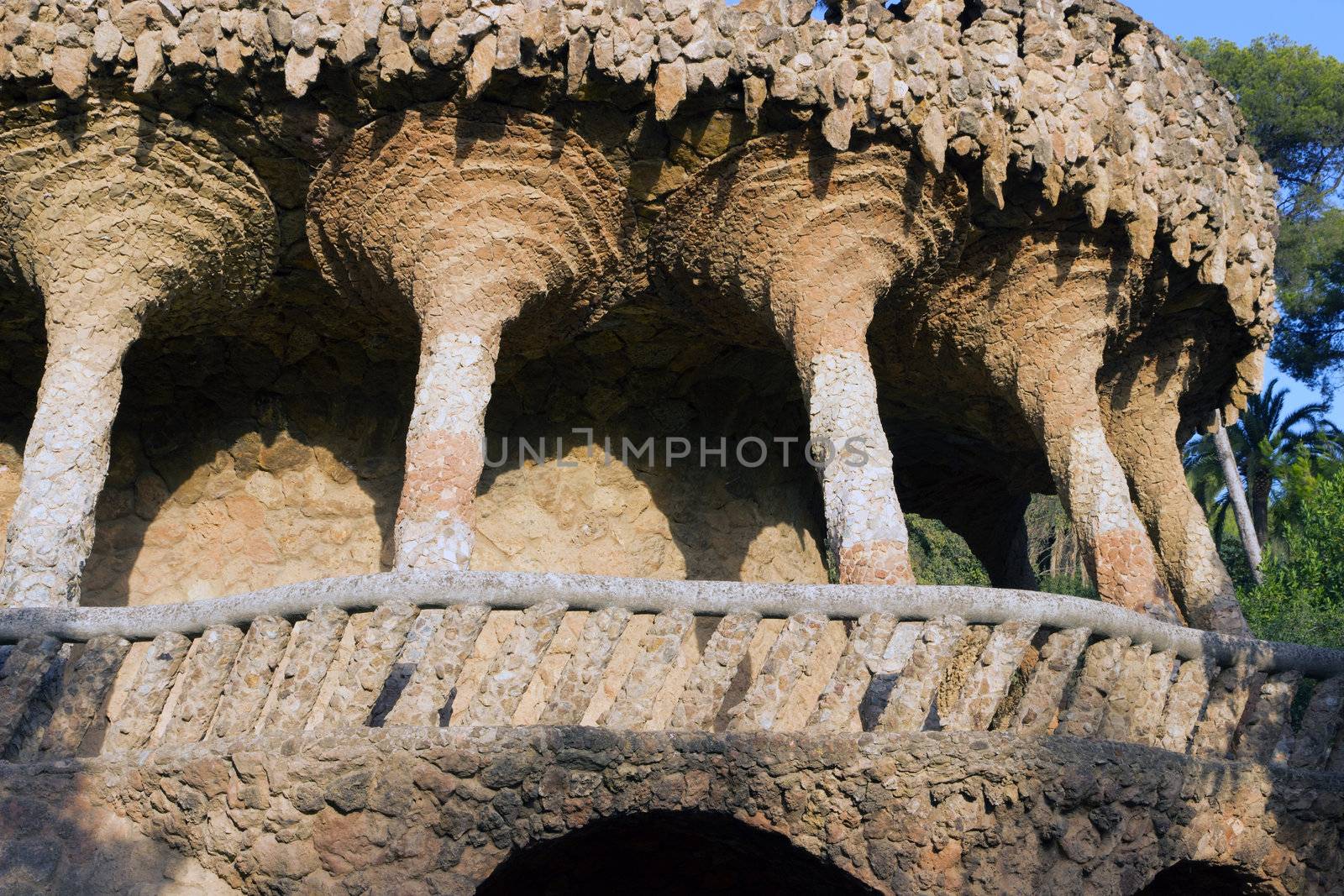 Columns stone aqueduct of a building designed by Gaudi in park Guel in Barcelona