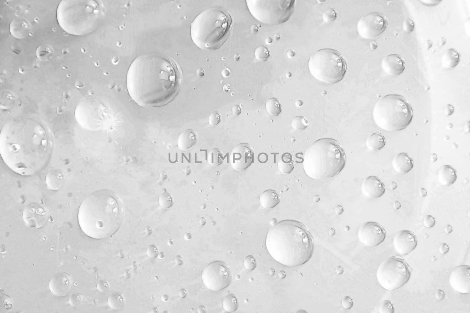 drops of water on glass, gray background