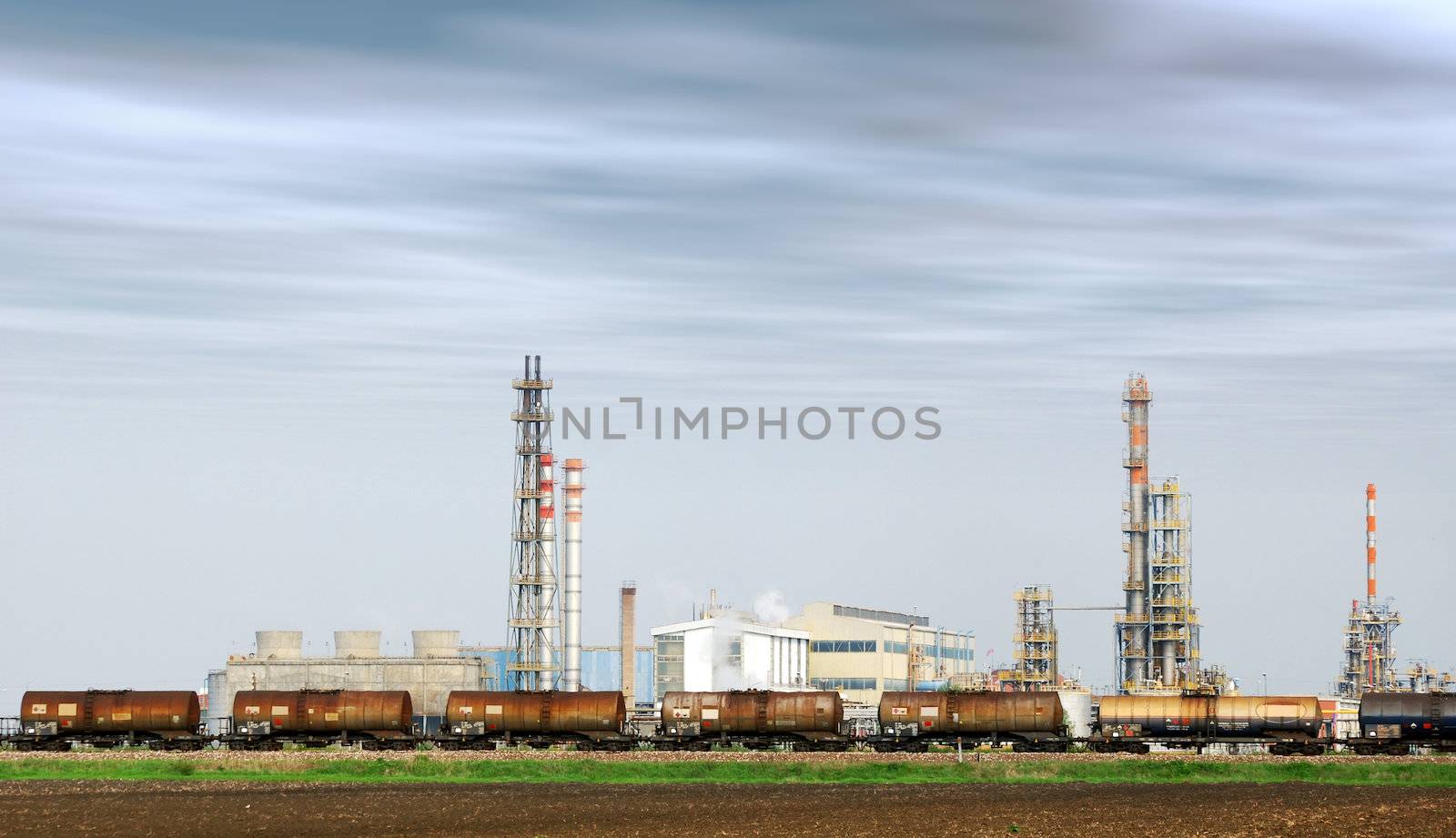 Heavy industry factory with train tanks