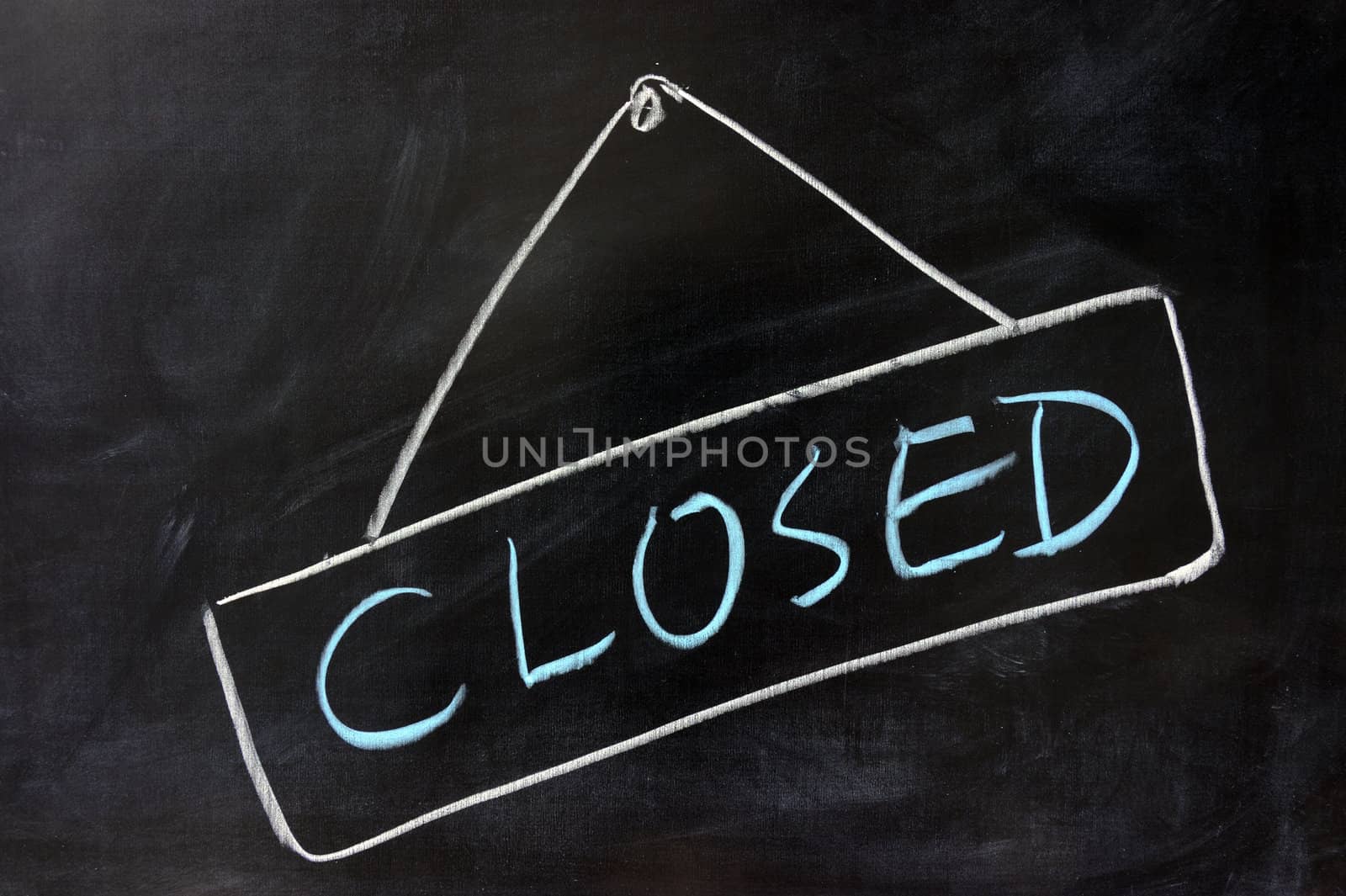 Chalk drawing - 'Closed' word written on chalkboard