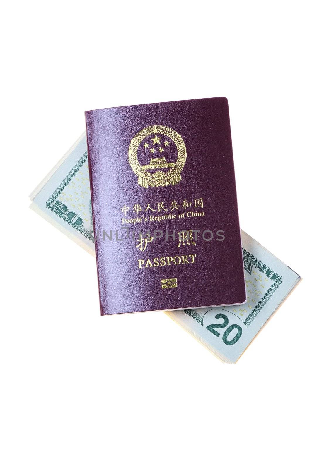 Chinese passport and a pile of US Dollars isolated on white