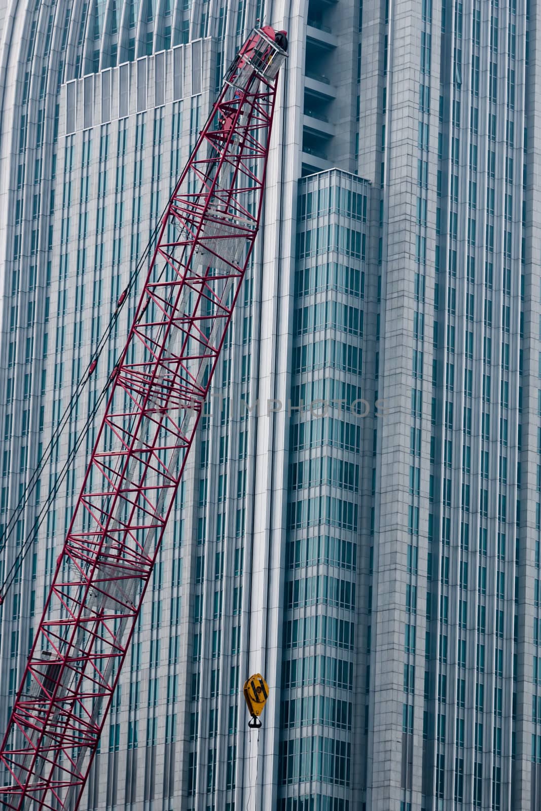 A crane before a modern building background