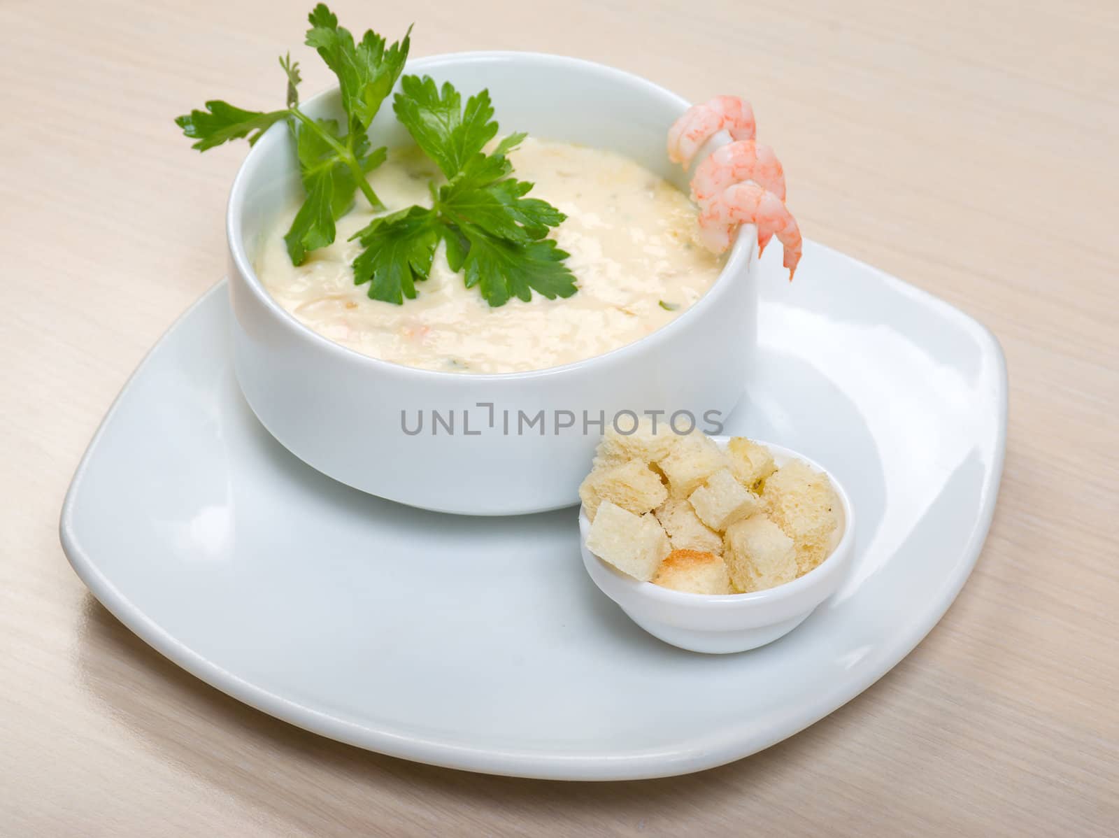 vegetable cream soup with prawns  close up 