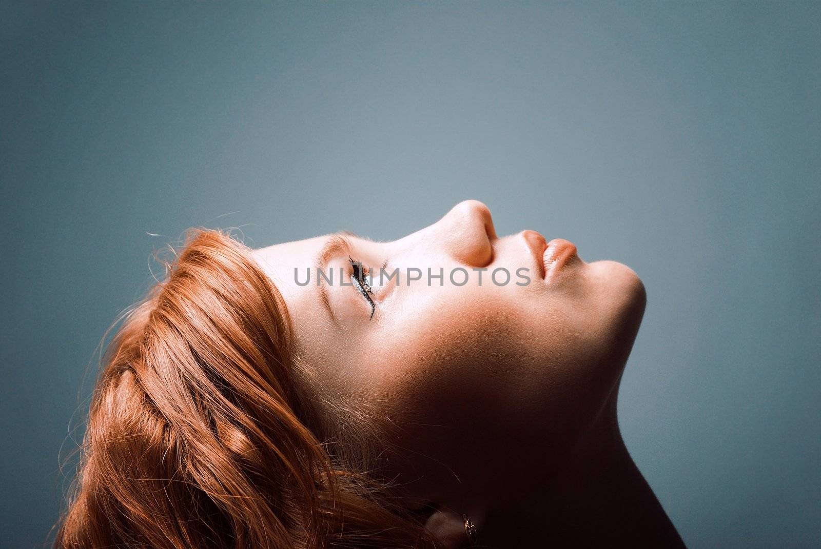 ashion portrait of a red hair woman, studio shot
