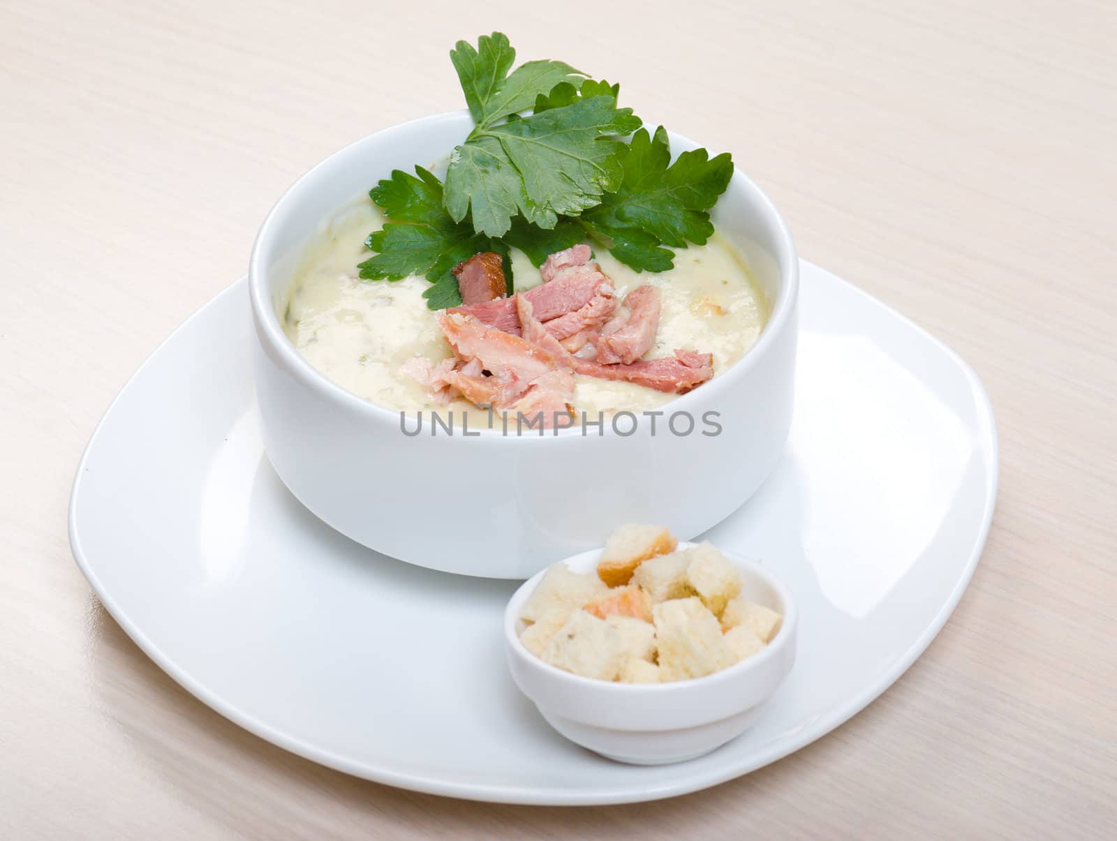 vegetable cream soup with smoked meat  close up 