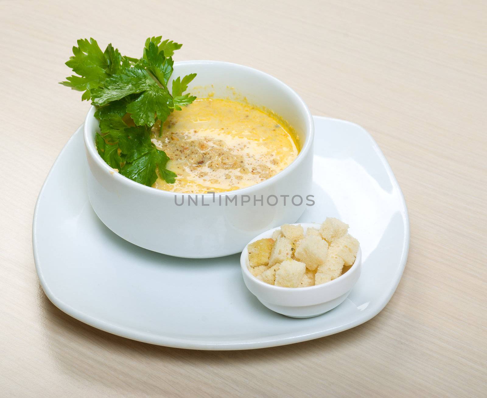 Onion Cream Soup Dressed with  Walnut and Parsley 