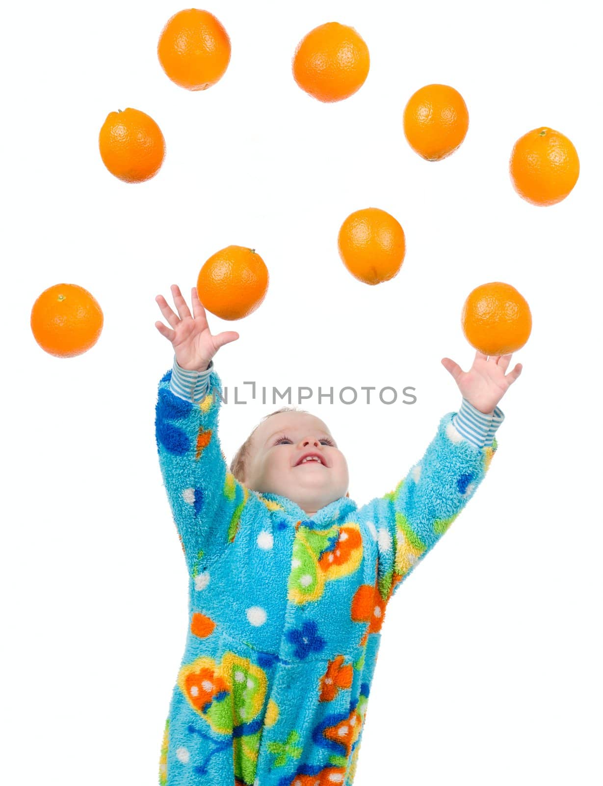 Little baby girl caughts orange .isolated on white background