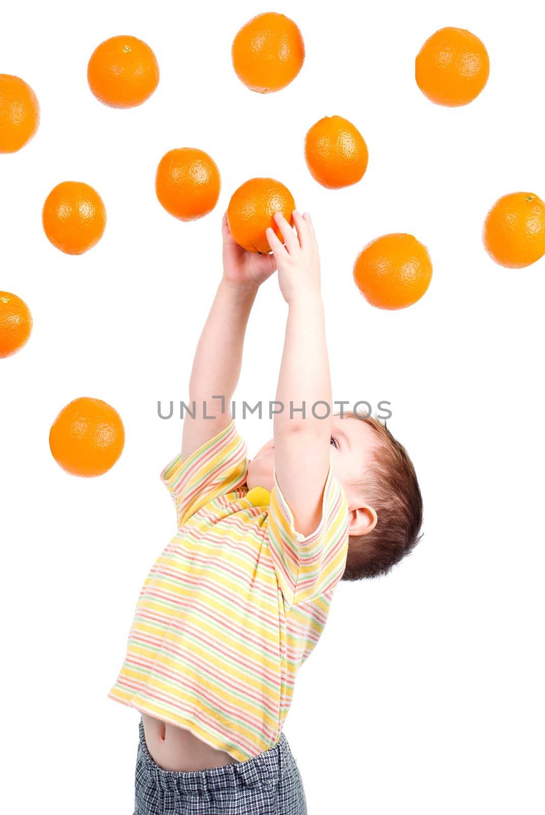 boy caughts flying oranges  isolated on white background by Fanfo