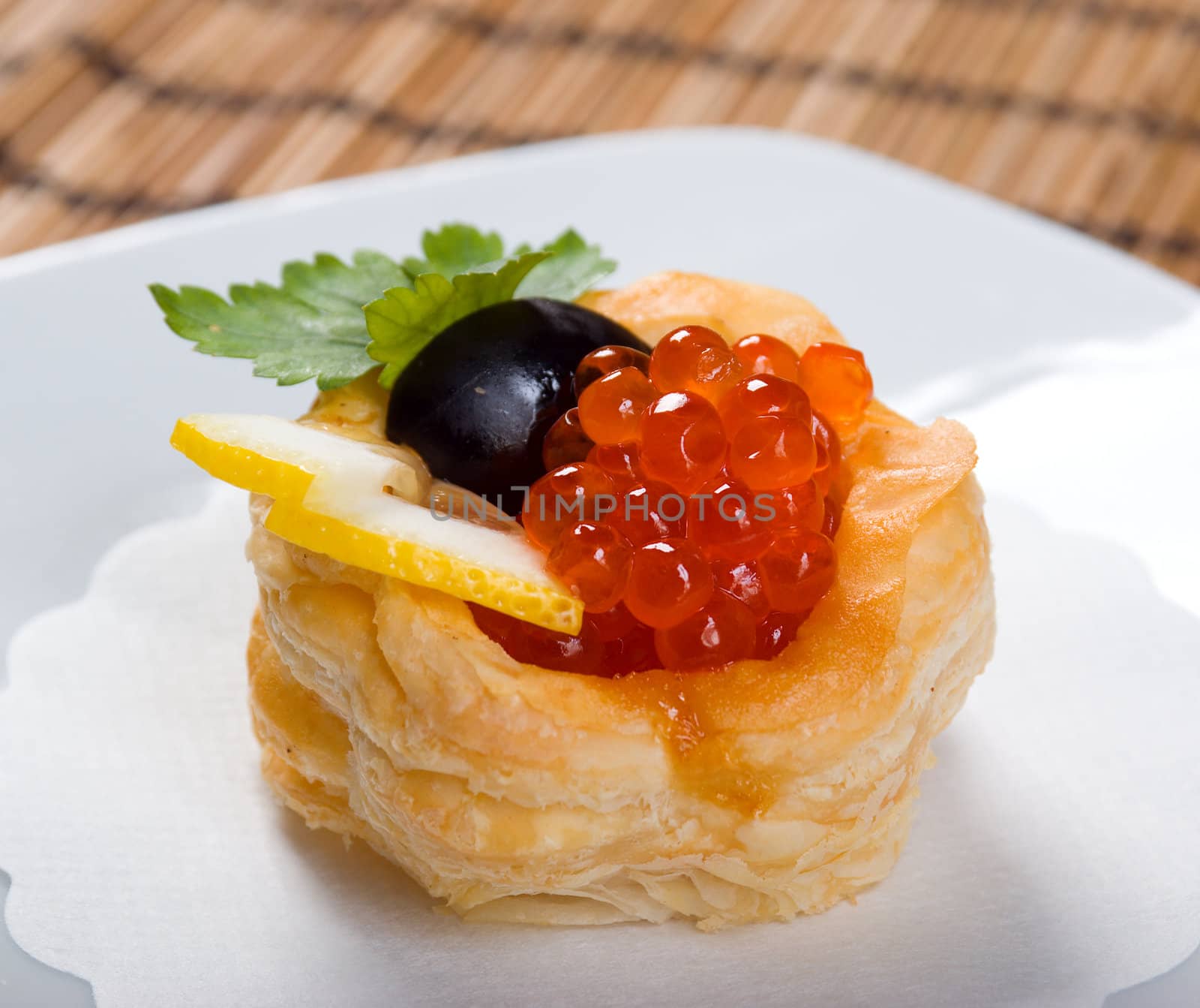   Canapes with red caviar  and lemon