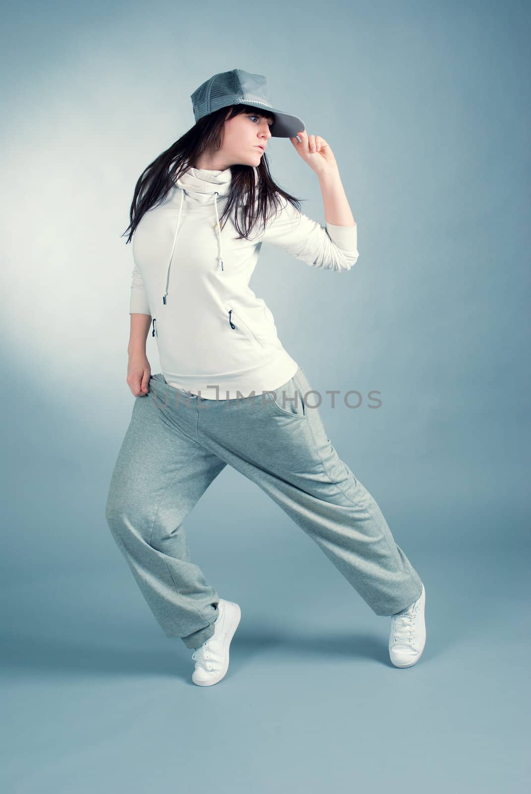 modern style dancer posing on  gray background 