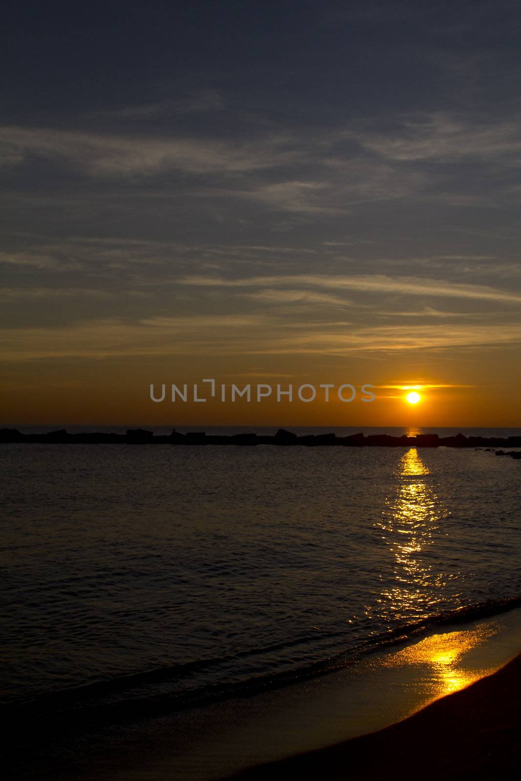 a sunrise on the beach of barcellona