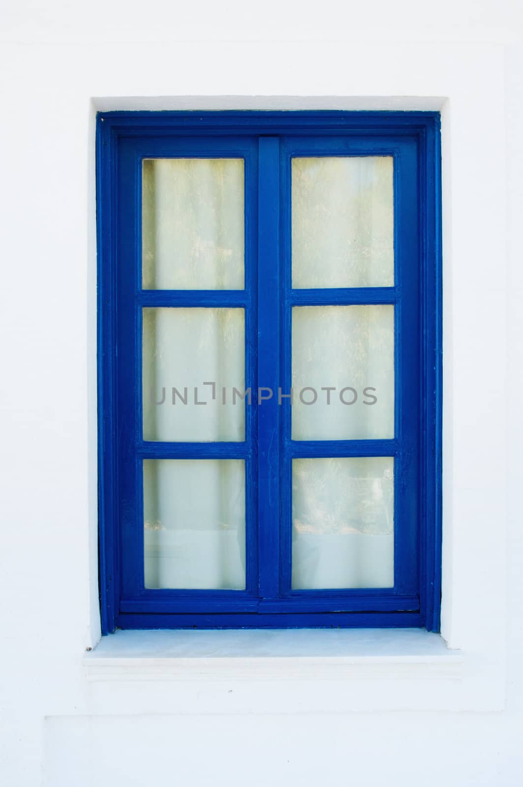 Blue Window on white House in Greece