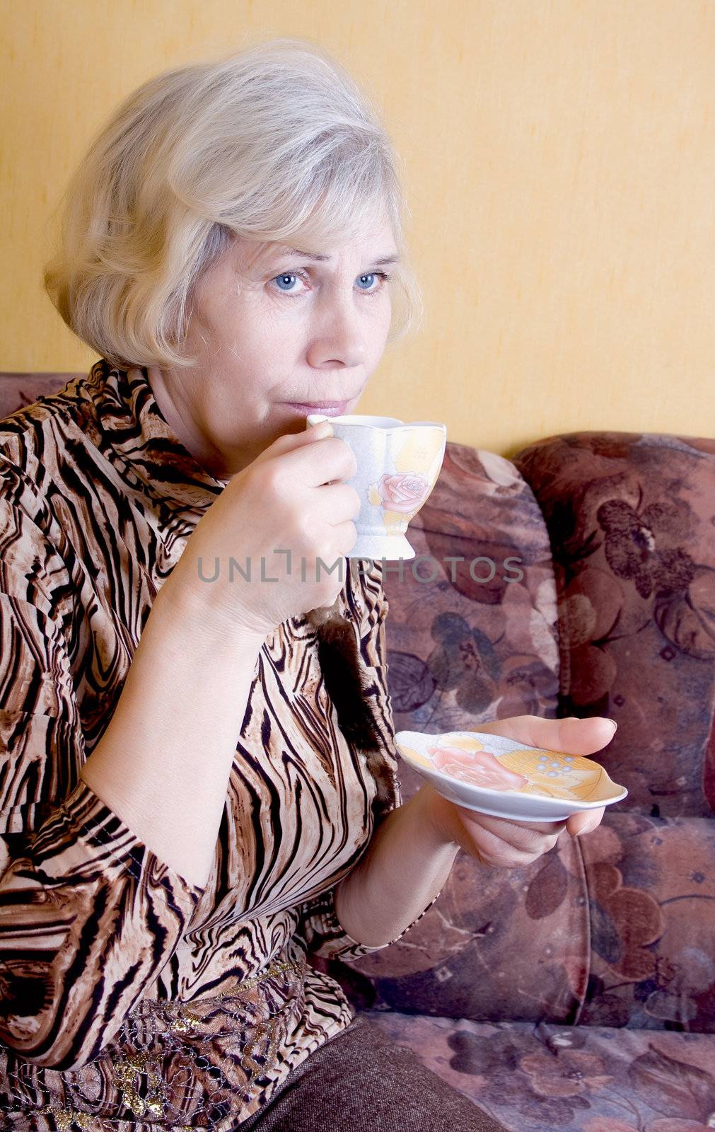 Woman relaxing drinks tea
