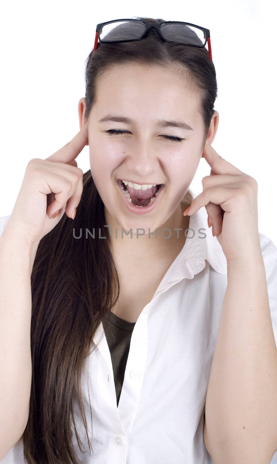 young woman suffers from noise pollution, covers his ears.
