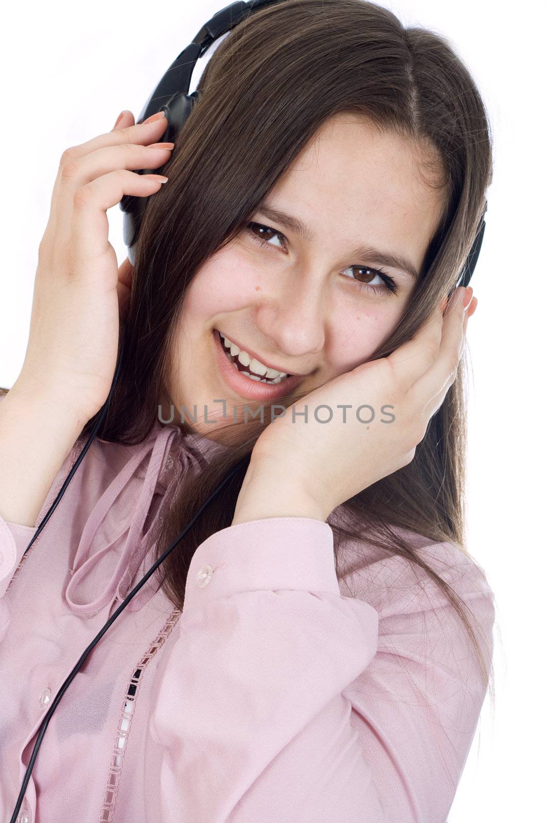 Woman with eyes closed listening to music on headphones.