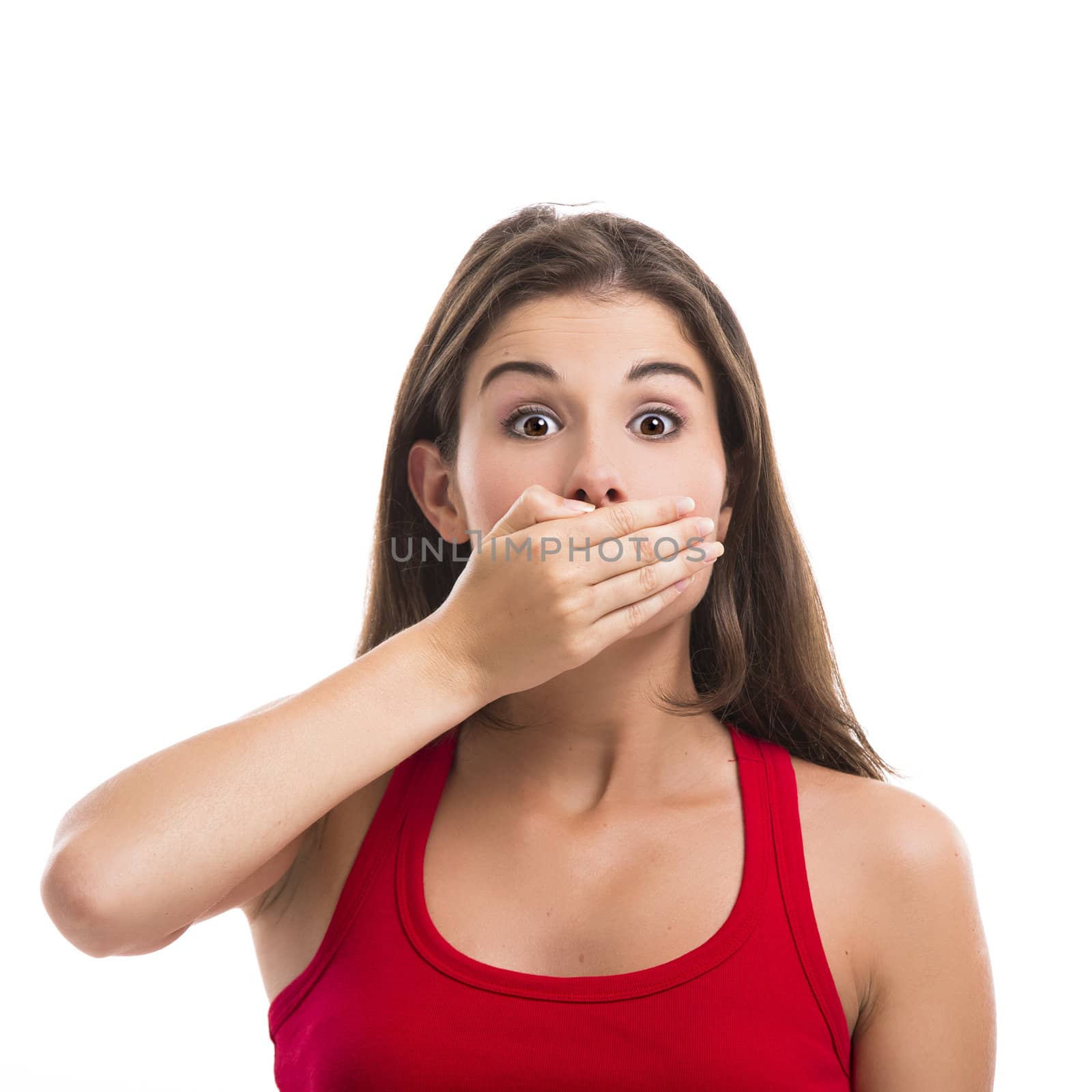 Beautiful young woman covering the mouth with her hand, isolated over a white background