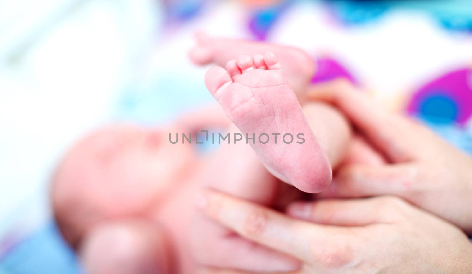 Foot of a newborn baby by langstrup