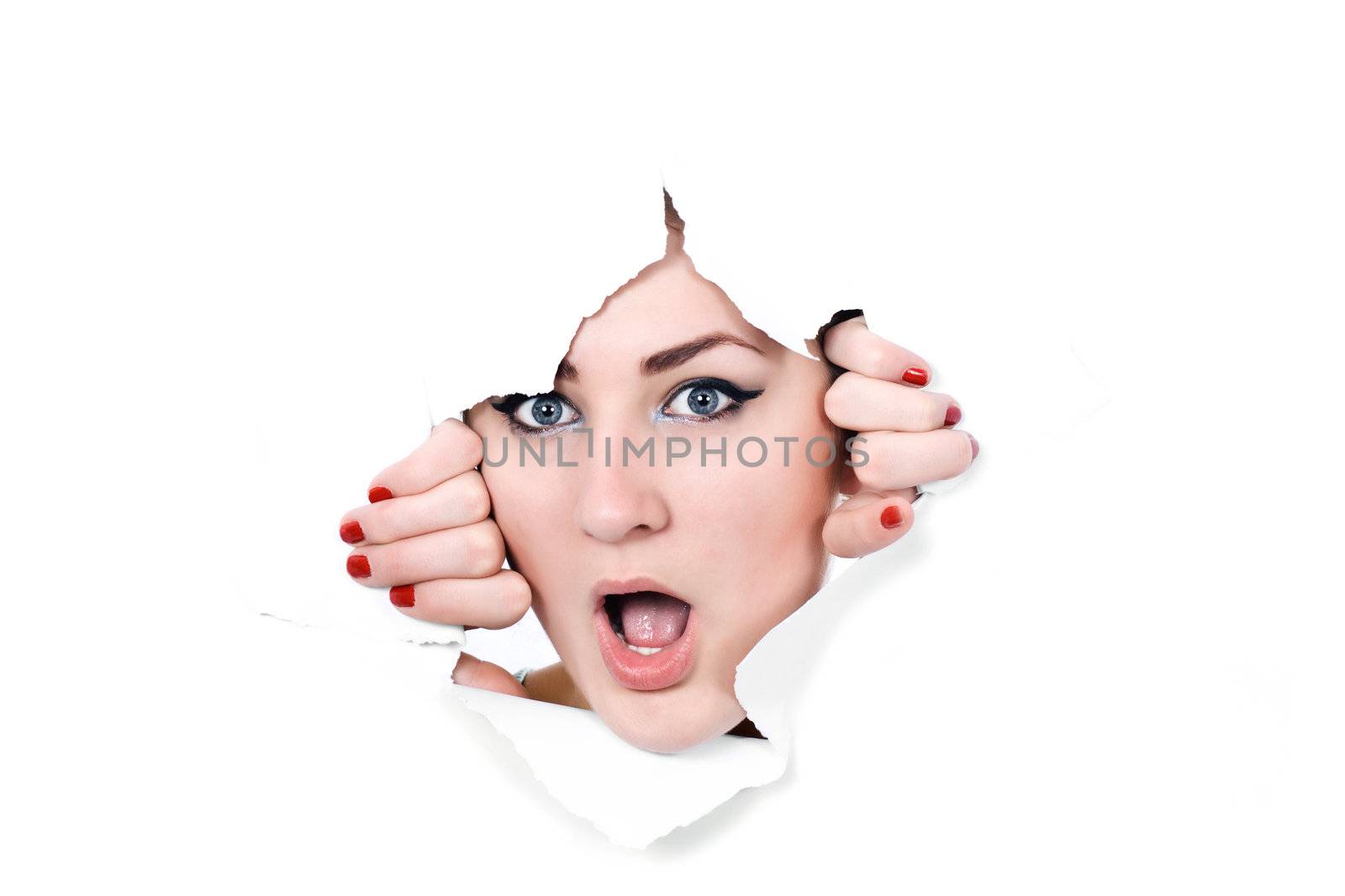 Shocked woman peeking through a hole