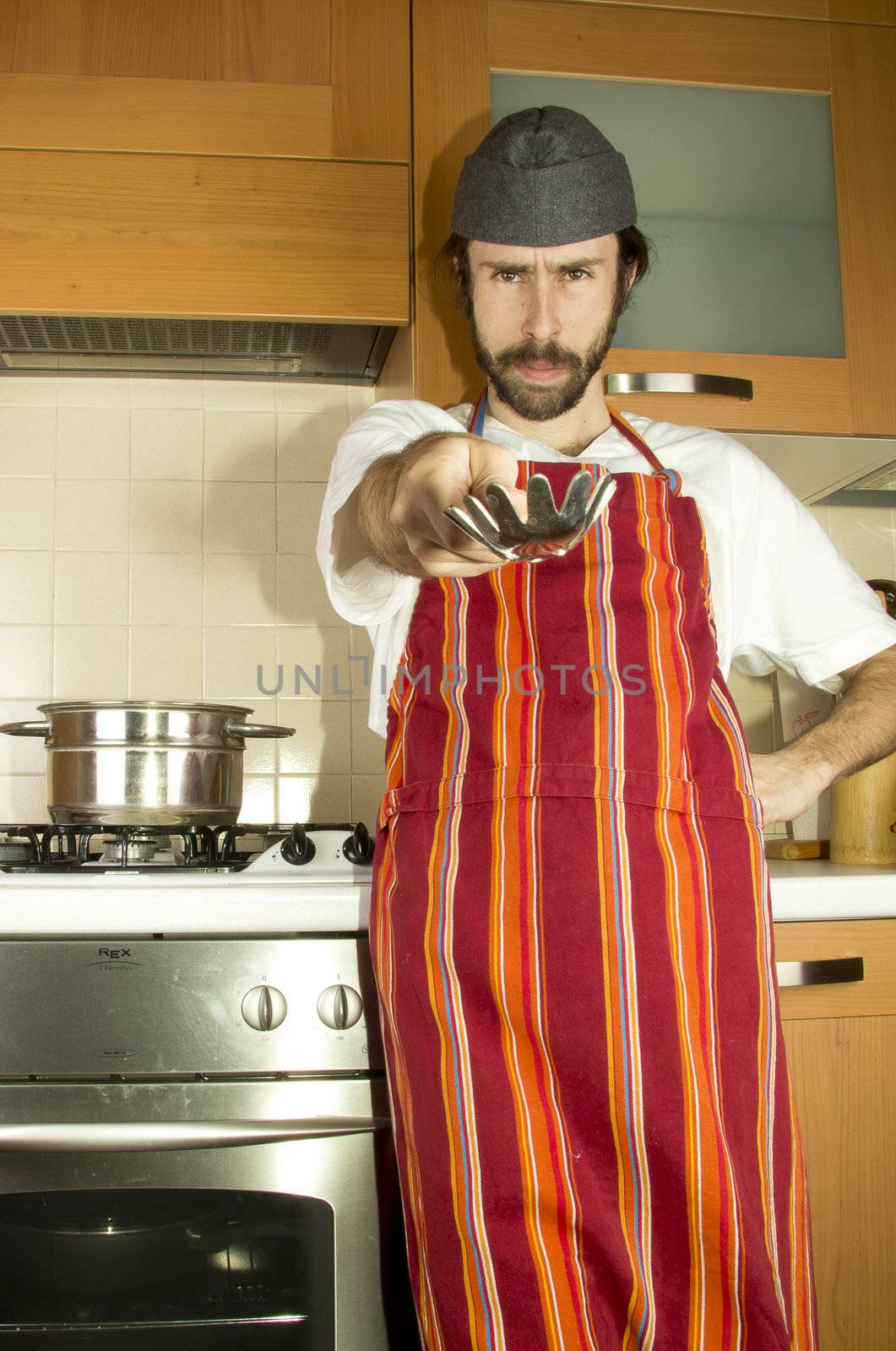 portrait of male chef with the fork