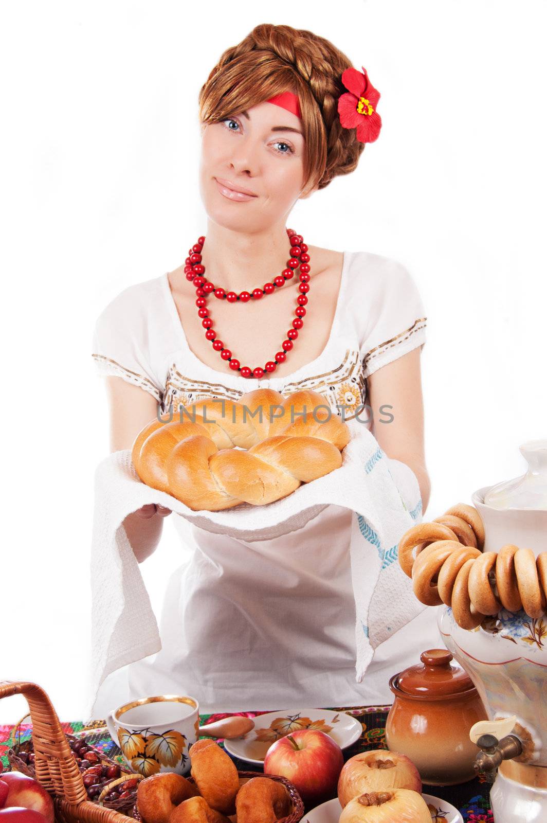 Hospitable russian woman offering traditional loaf by Angel_a