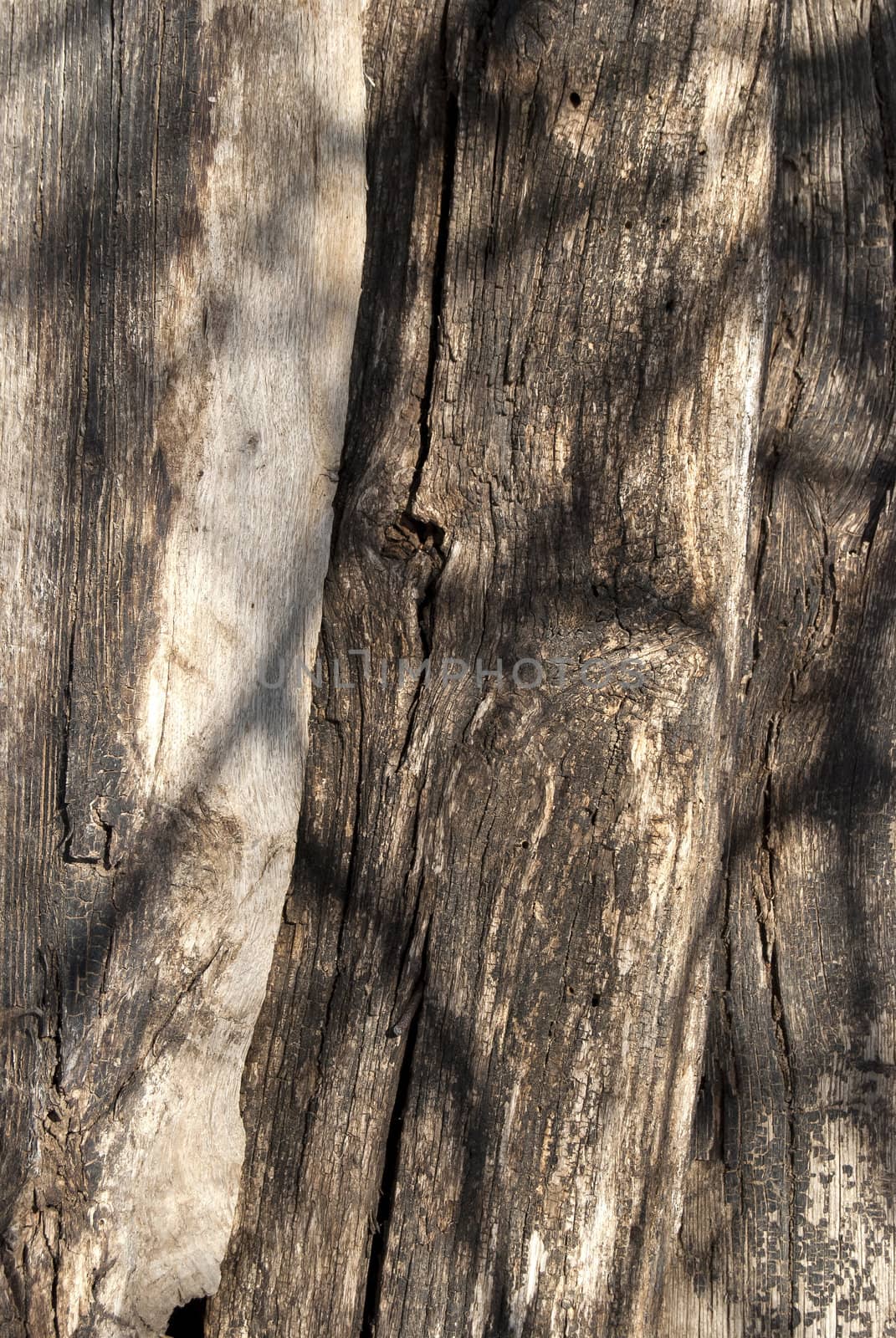 Old wooden stacked weathered beams as background