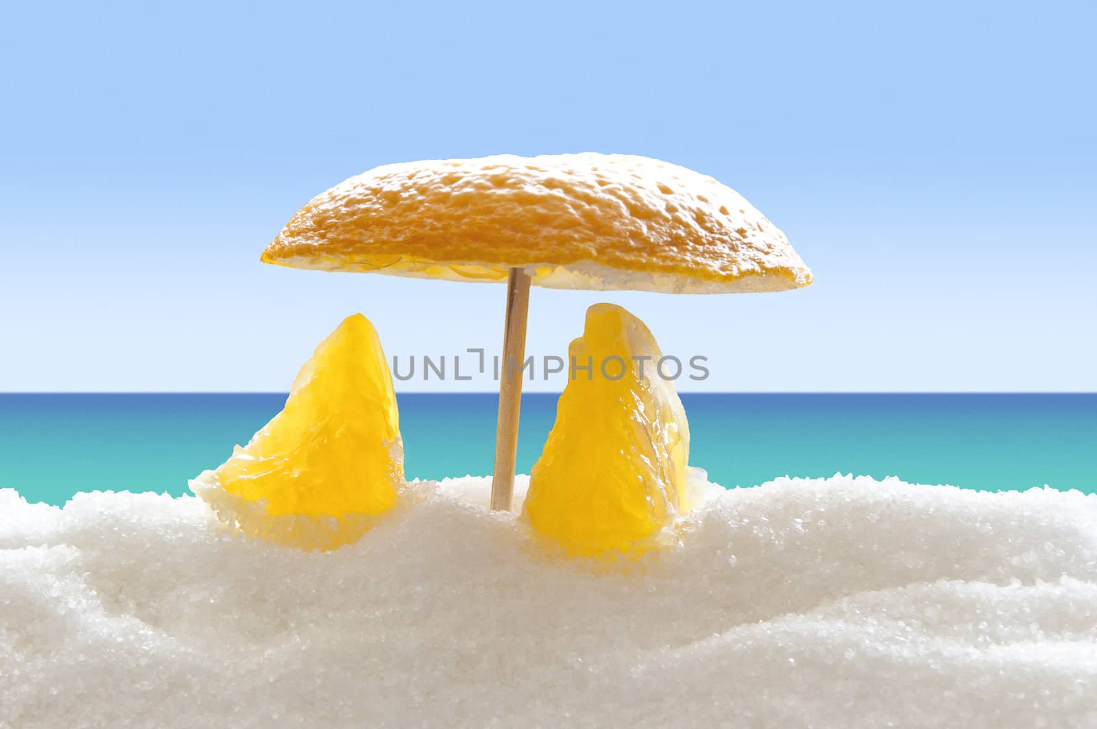 Two orange pieces under orange umbrella on the sugar beach