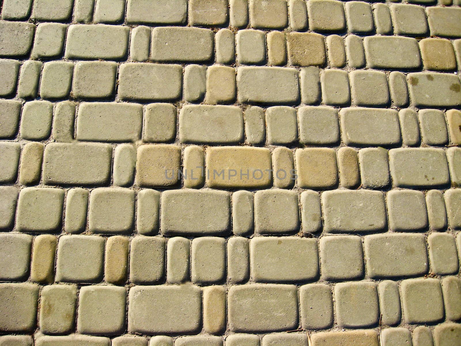 The image of roadway laid out from a white brick