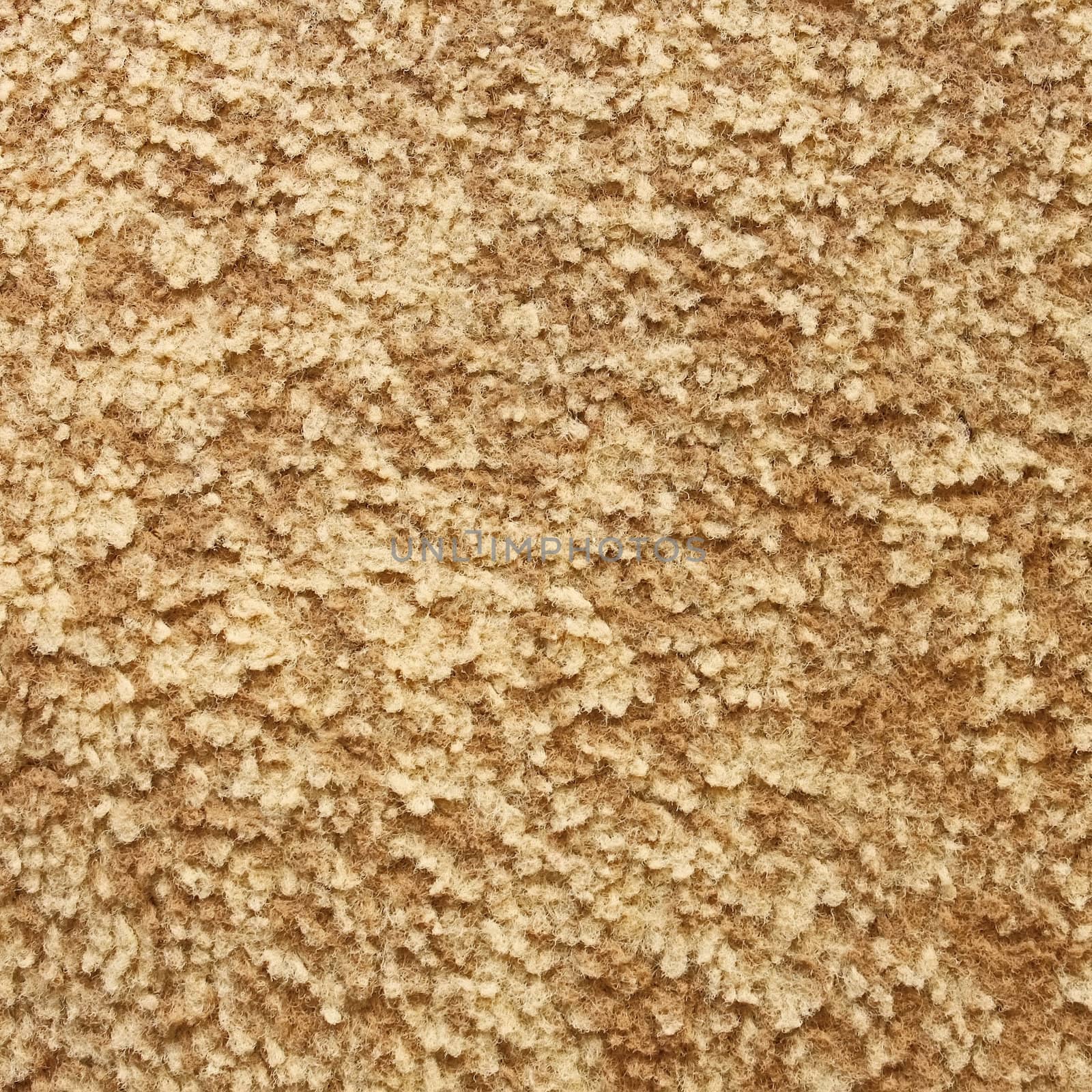 Textured details of carpet with fleecy synthetic fabric of beige color close up