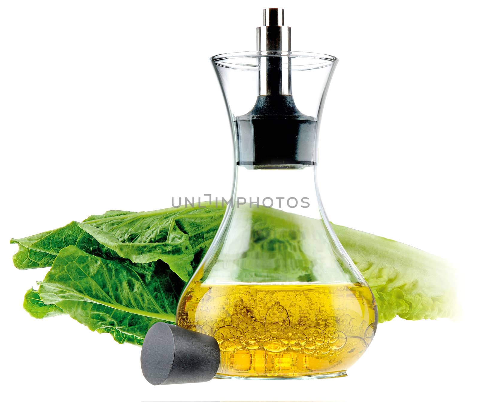 Bottle with a thread of olive oil isolated on white background