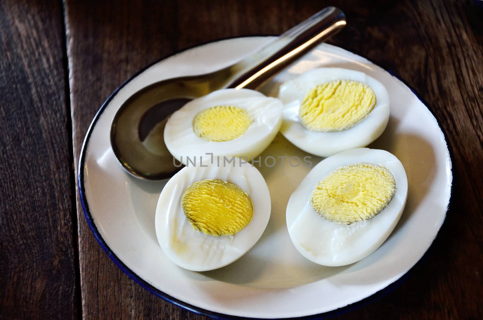 Half of boiled egg in white vintage dish