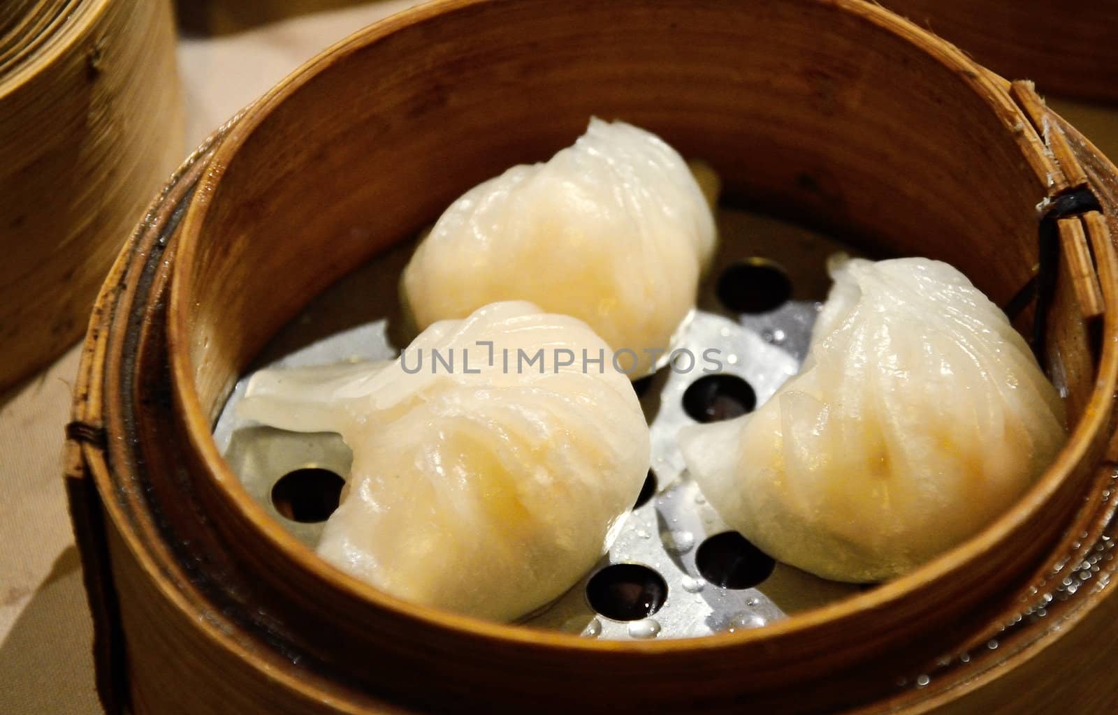 Chinese steamed dimsum in bamboo containers traditional cuisine 