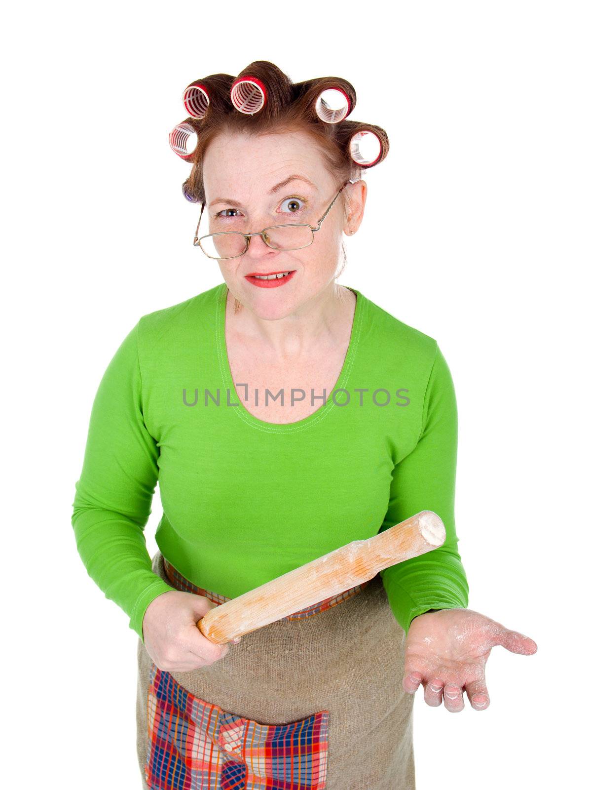 Woman in hair rollers is holding . Very frustrated and angry mad woman. Angry look on face. Studio, white background.
