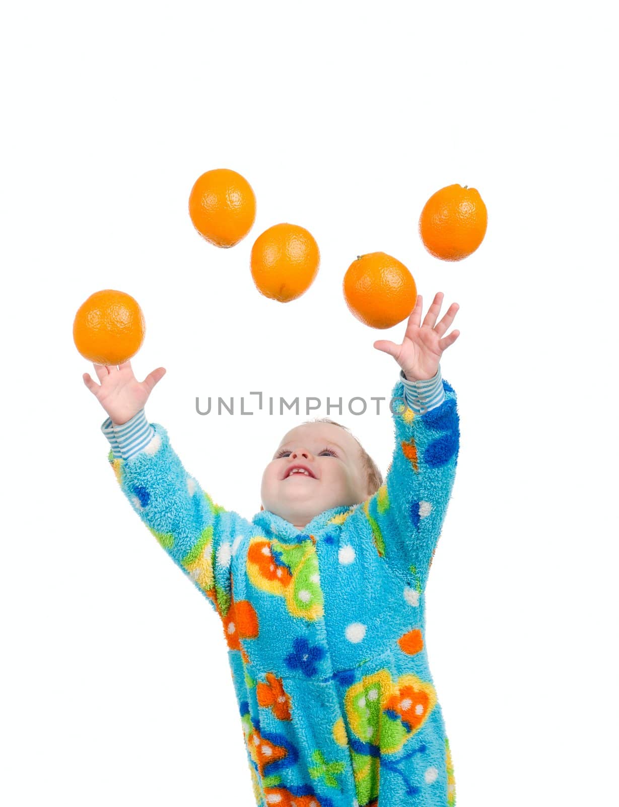 Little baby girl caughts orange .isolated on white background