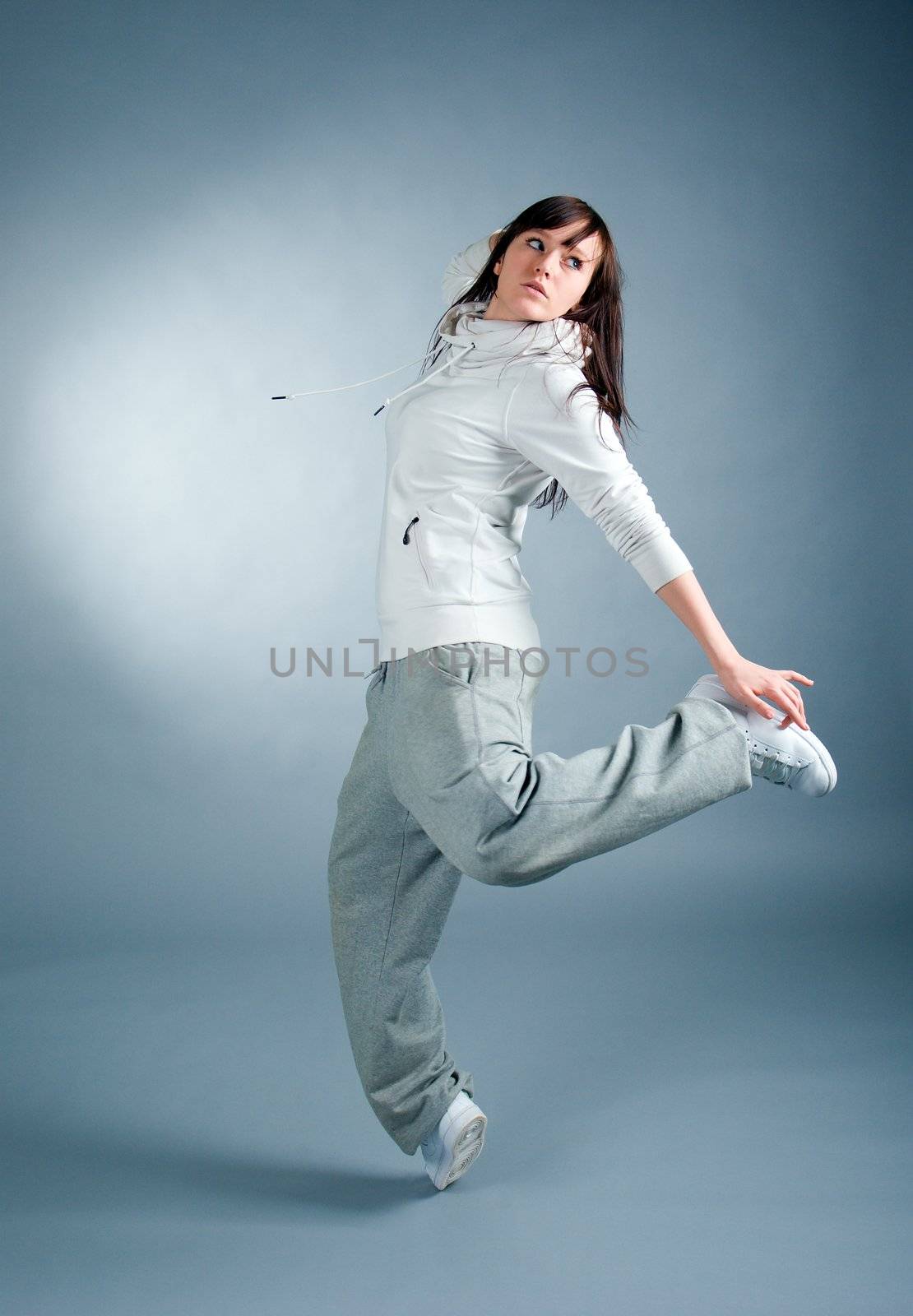 modern style dancer posing on  gray background 