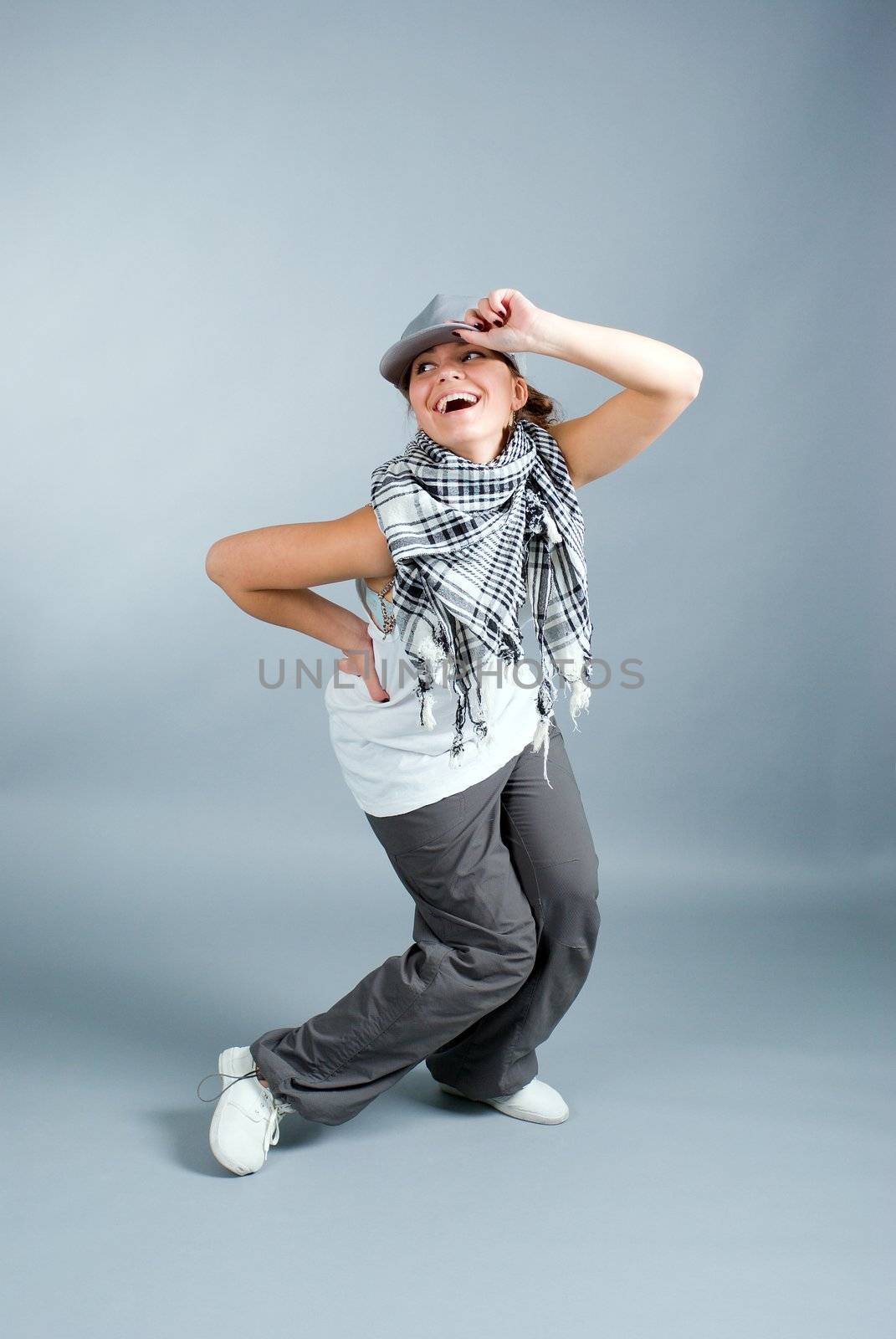 modern style dancer posing on  gray background 