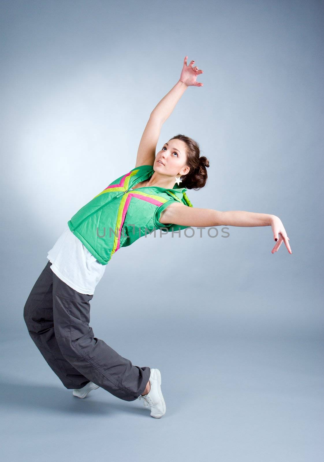 modern style dancer posing on  gray background 