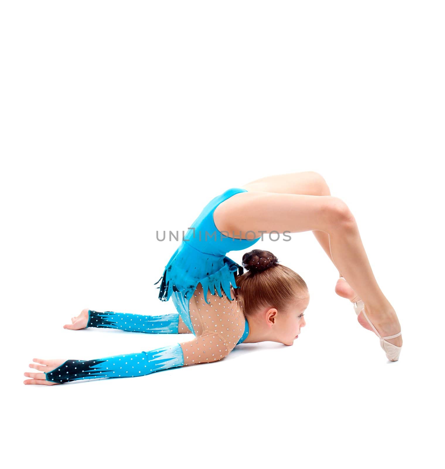 little girl makes gymnastic over white background 