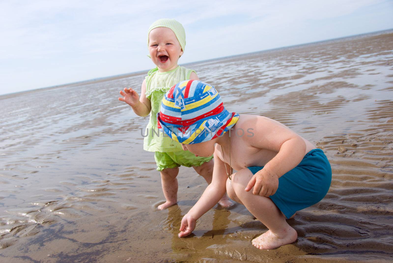 kids playing at the beach .White Sea