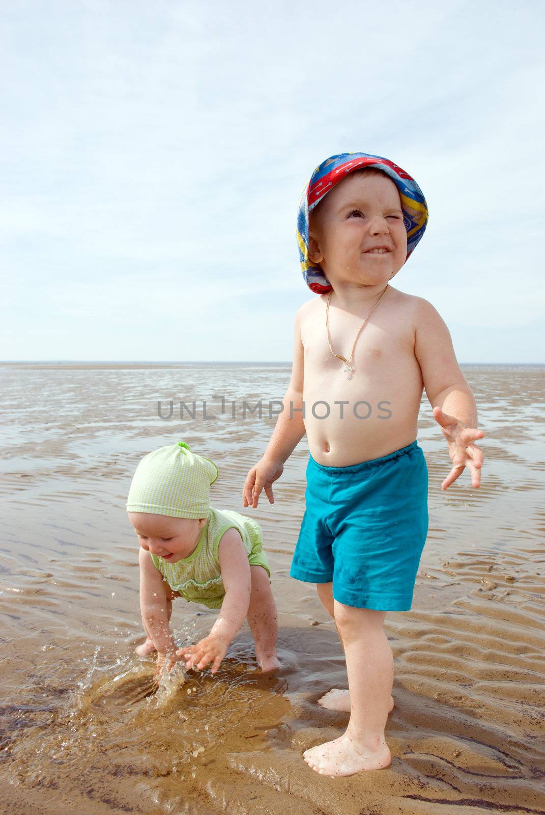 kids playing at the beach .White Sea