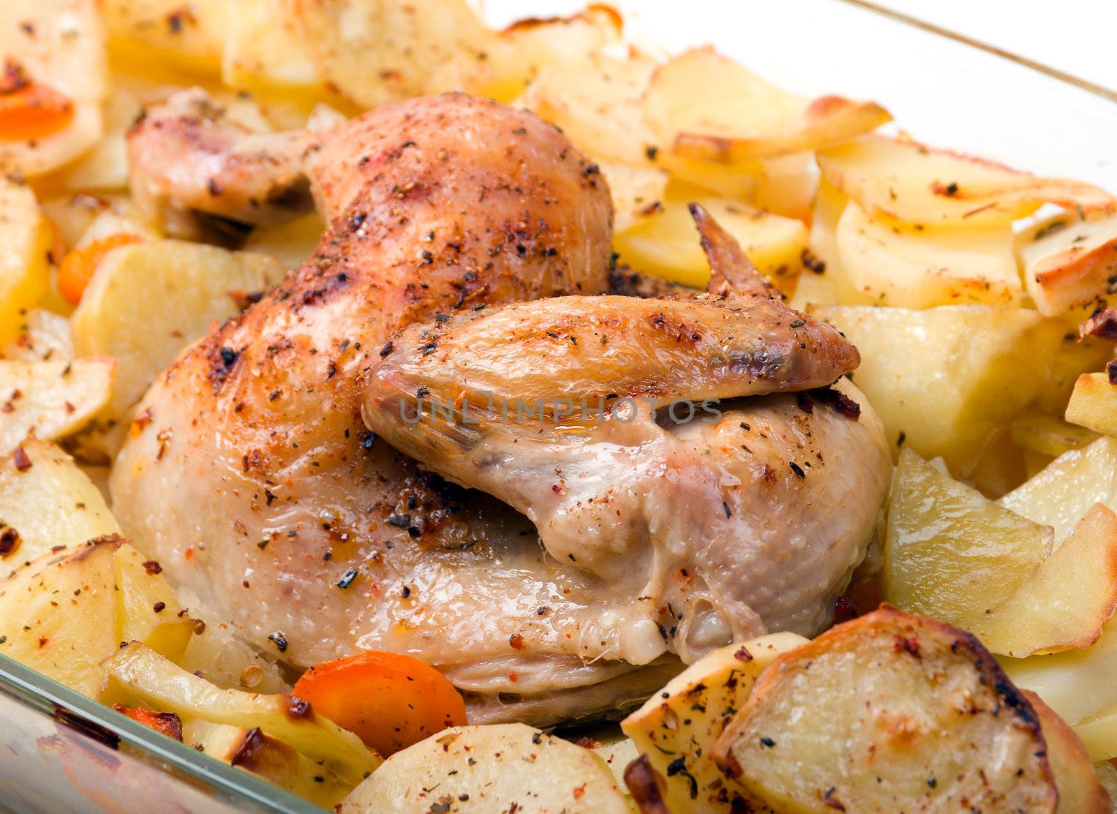 Potato with a hen on grill .Whole Roast chicken
