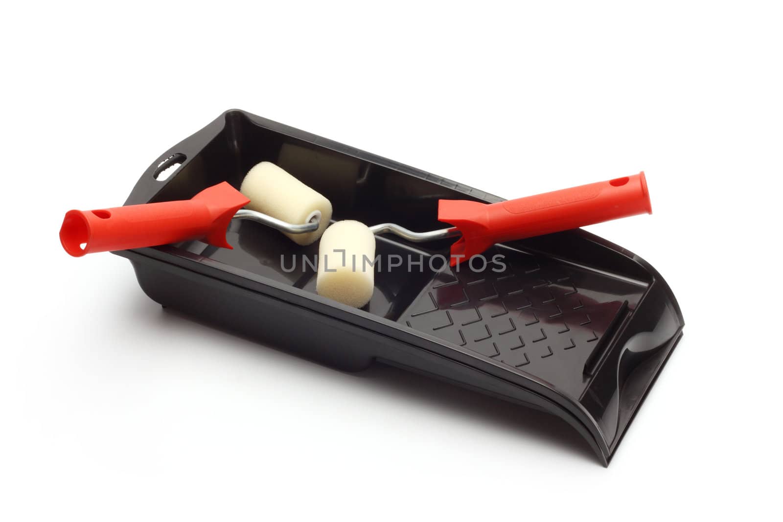 Roller brush and tray close up on white