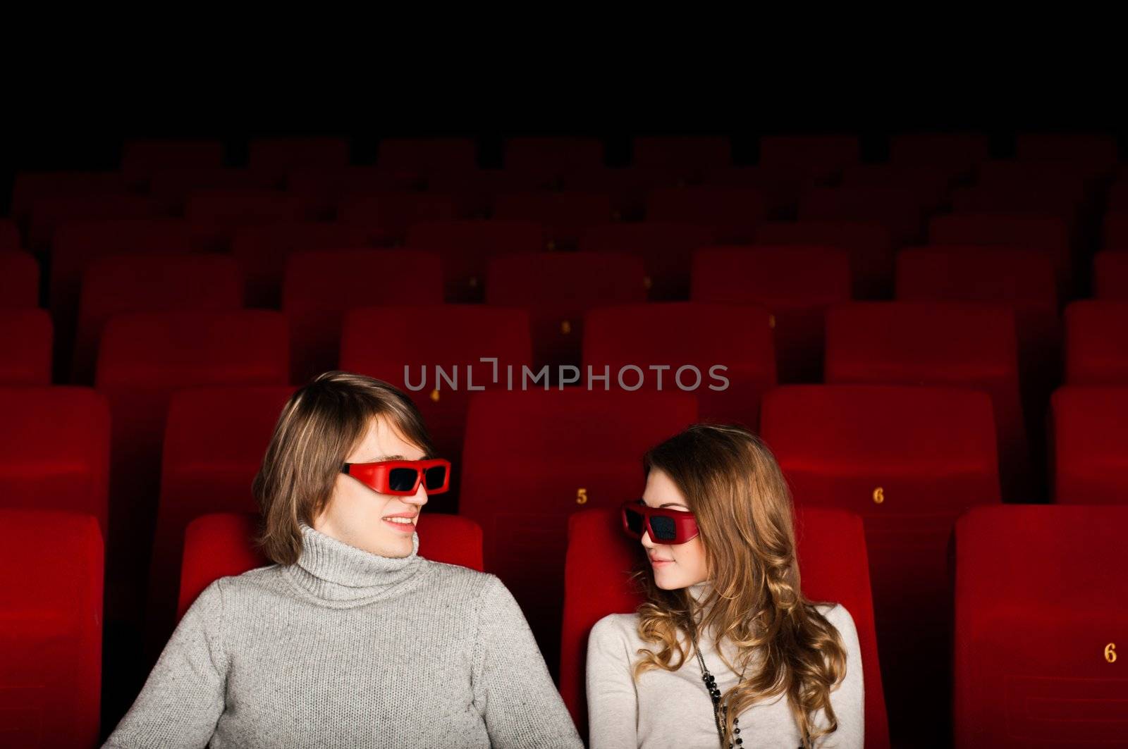 young couple in the cinema to enjoy the movie